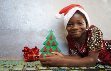 Christmas Diversity Symbol Gorgeous African Black Girl Celebratingの写真素材