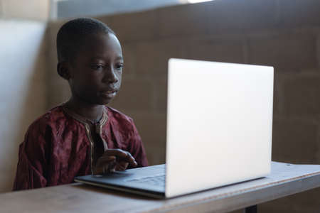 Technology for Future Africa, Black Boy Learning with Laptopの写真素材