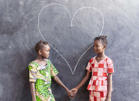 Gorgeous Black African Cute Girls Posing Together Looking Smilingの写真素材