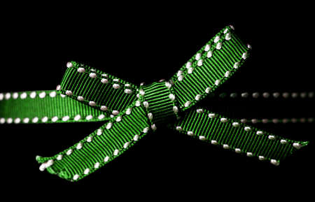 Close up of green ribbon on black backgroundの写真素材