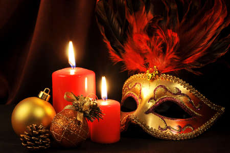 Christmas tree decoration with candles and maskの写真素材