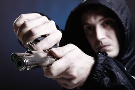 Gang member prepare to shoot his enemy. Shot taken with 5d mark II and 24-70mm F2.8Lの写真素材