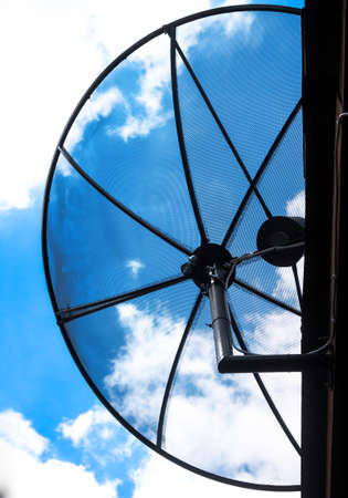 Half Satellite dish with sky backgroundの写真素材