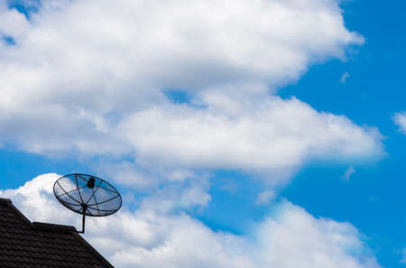 Satellite dish with blue sky backgroundの写真素材