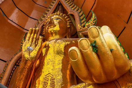 Big golden Buddha in temple, Kanchanaburi province Thailandの写真素材