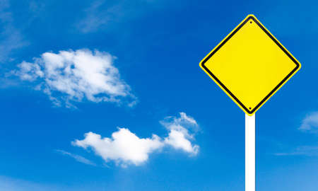 Blank yellow road sign on sky backgroundの写真素材