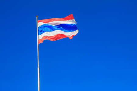 Thai flag of Thailand with blue sky background.の写真素材
