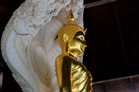 a style of Buddha with a naga over His head in Nan Province,Thailandの写真素材