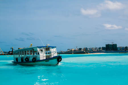 Beautiful tropical Maldives resort and island with beach and sea on blue sky for holiday vacation