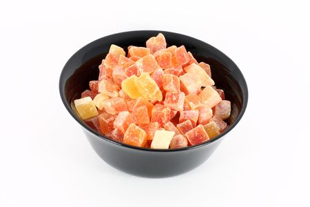 Black bowl full of dried papayaの写真素材
