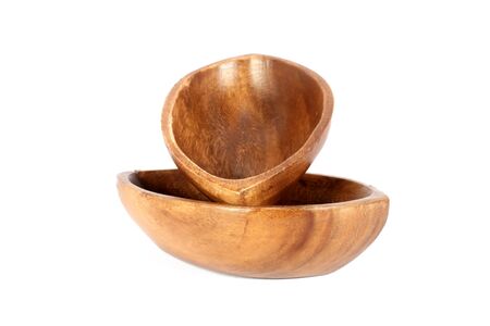 Two brown wooden bowl isolated on whiteの写真素材