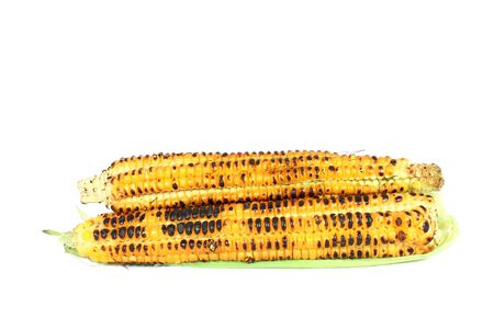 Grilled sweet corn cob isolated on whiteの写真素材