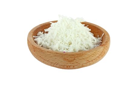 Coconut meal in a wooden bowl isolated on whiteの写真素材