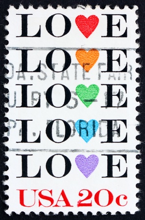 United States of America - circa 1984: a stamp printed in the United States of America shows word love with stylized hearts, circa 1984の写真素材
