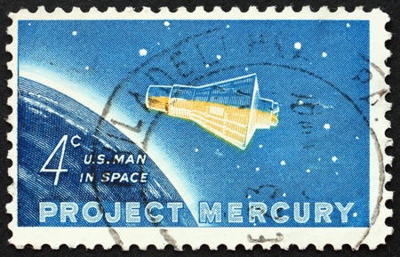UNITED STATES OF AMERICA - CIRCA 1962: a stamp printed in the United States of America shows Project Mercury, Friendship 7 capsule and Globe, circa 1962の写真素材