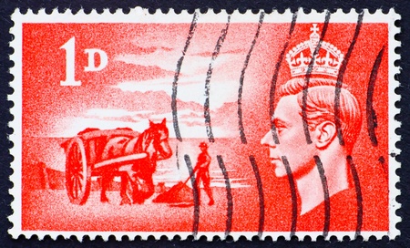 GREAT BRITAIN - CIRCA 1948: a stamp printed in the Great Britain shows Gathering seaweed, circa 1948の写真素材