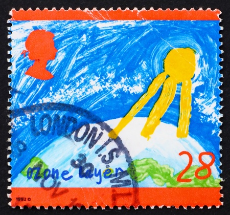 GREAT BRITAIN - CIRCA 1992: a stamp printed in the Great Britain shows Childrens drawing Ozone Layer, Protect the Environment, circa 1992の写真素材