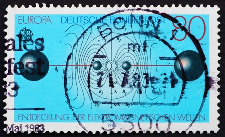 GERMANY - CIRCA 1983: a stamp printed in the Germany shows Resonant Circuit, Electric Flux Lines, Discovery of Electromagnetic Waves by Heinrich Hertz, circa 1983の写真素材