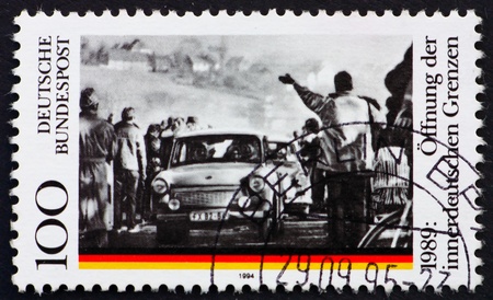 GERMANY - CIRCA 1995: a stamp printed in the Germany shows Opening of the Berlin Wall, 5th Anniversary, circa 1995の写真素材