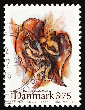 DENMARK - CIRCA 1992: a stamp printed in the Denmark shows Jacobs fight with angel, from new Danish Bible, circa 1992の写真素材