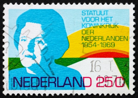 NETHERLANDS - CIRCA 1969: a stamp printed in the Netherlands shows Queen Juliana and Rising Sun, 15th anniversary of the Charter of the Kingdom of the Netherlands, circa 1969のeditorial素材