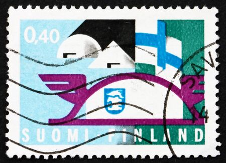 FINLAND - CIRCA 1969: a stamp printed in the Finland shows Emblems and Flag, circa 1969の写真素材