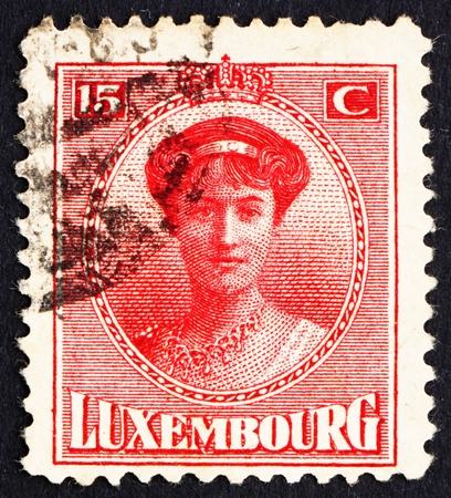 LUXEMBOURG - CIRCA 1921: a stamp printed in the Luxembourg shows Charlotte, Grand Duchess of Luxembourg, Reign from 1919 to 1964, circa 1921のeditorial素材