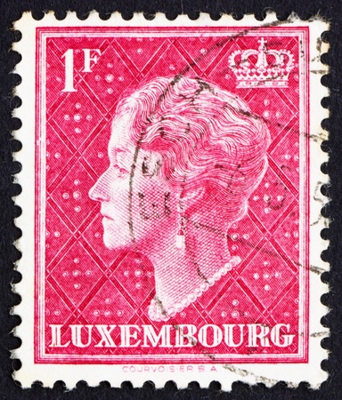 LUXEMBOURG - CIRCA 1948: a stamp printed in the Luxembourg shows Charlotte, Grand Duchess of Luxembourg, Reign from 1919 to 1964, circa 1948のeditorial素材