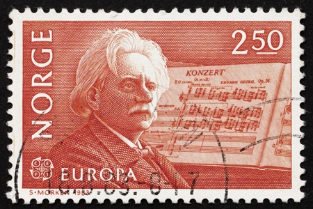 NORWAY - CIRCA 1983: a stamp printed in the Norway shows Edvard Grieg, Composer and his Piano Concerto in A-minor, circa 1983のeditorial素材