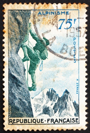 FRANCE - CIRCA 1956: a stamp printed in the France shows Mountain Climbing, circa 1956の写真素材
