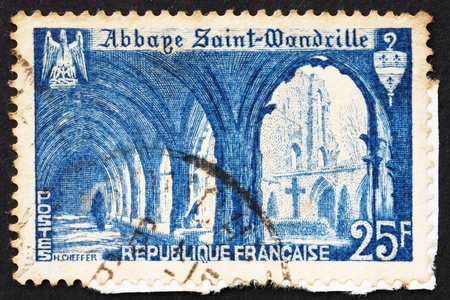 FRANCE - CIRCA 1949: a stamp printed in the France shows Cloister of St. Wandrille Abbey, circa 1949の写真素材