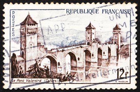 FRANCE - CIRCA 1955: a stamp printed in the France shows Valentre Bridge, Cahors, circa 1955の写真素材