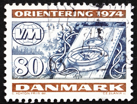 DENMARK - CIRCA 1974: a stamp printed in the Denmark shows Compass, World Orienteering Championships 1974, circa 1974の写真素材