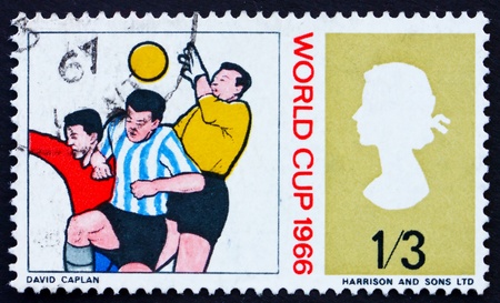 GREAT BRITAIN - CIRCA 1966: a stamp printed in the Great Britain shows Goalkeeper and Two Soccer Players, World Soccer Championship 1966, Wembley circa 1966の写真素材