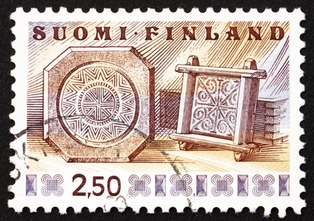 FINLAND - CIRCA 1976: a stamp printed in the Finland shows Cheese Frames, circa 1976の写真素材
