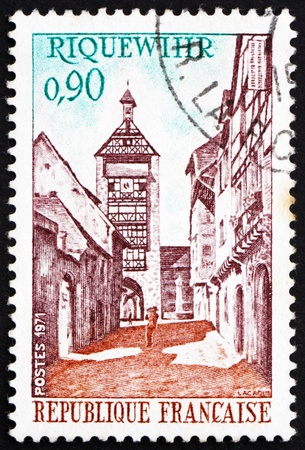 FRANCE - CIRCA 1971: a stamp printed in the France shows Dolder Tower and Street, Riquewihr, France, circa 1971の写真素材