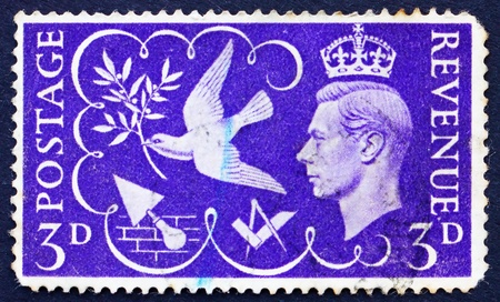GREAT BRITAIN - CIRCA 1946: a stamp printed in the Great Britain shows King George VI and Symbols of Peace and Industry, circa 1946のeditorial素材