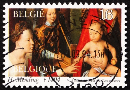 BELGIUM - CIRCA 1994: a stamp printed in the Belgium shows Detail of Painting by Hans Memling, circa 1994のeditorial素材