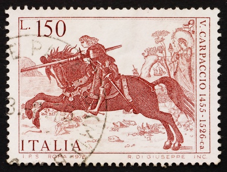 ITALY - CIRCA 1976: a stamp printed in the Italy shows St. George, Painting by Vittore Carpaccio, Venetian Painter, circa 1976のeditorial素材