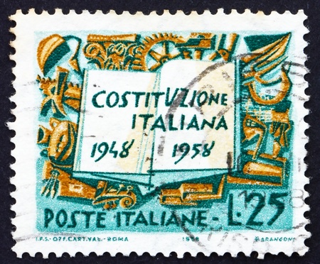 ITALY - CIRCA 1958: a stamp printed in the Italy shows Book and Symbols of Labor Industry and Agriculture, 10th Anniversary of the Constitution, circa 1958のeditorial素材