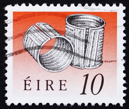 IRELAND - CIRCA 1990: a stamp printed in the Ireland shows Derrinboy Armlets, Art Treasure of Ireland, circa 1990のeditorial素材