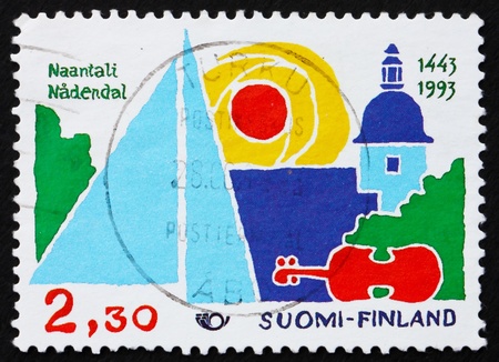 FINLAND - CIRCA 1995: a stamp printed in the Finland shows Town of Naantali, 550th Anniversary, Important Tourist Center, circa 1995のeditorial素材