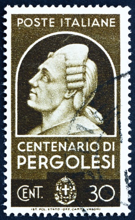 ITALY - CIRCA 1937: a stamp printed in the Italy shows Giovanni Battista Pergolesi, Composer, Violinist and Organist, circa 1937のeditorial素材