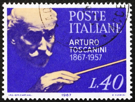 ITALY - CIRCA 1967: a stamp printed in the Italy shows Arturo Toscanini, Conductor, circa 1967のeditorial素材