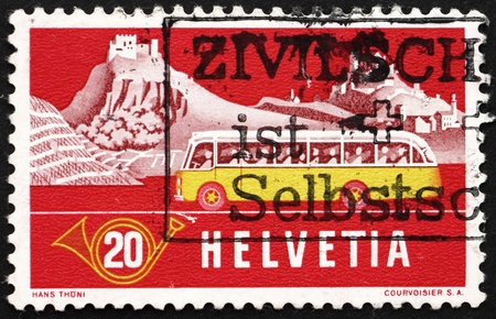 SWITZERLAND - CIRCA 1953: a stamp printed in the Switzerland shows Alpine Post Bus, Summer Background, circa 1953のeditorial素材