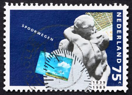 NETHERLANDS - CIRCA 1989: a stamp printed in the Netherlands shows Passengers, 150th Anniversary of Dutch Railways, circa 1989のeditorial素材