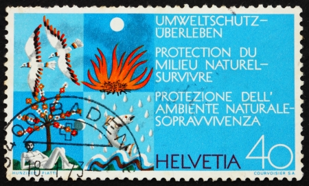 SWITZERLAND - CIRCA 1972: a stamp printed in the Switzerland shows Four Clean Elements, Air, Earth, Water and Fire, Environmental Protection, circa 1972のeditorial素材