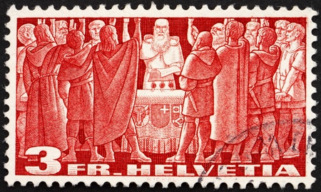 SWITZERLAND - CIRCA 1938: a stamp printed in the Switzerland shows First Federal Pact, Federal Charter, 1291, the Birth of the Old Swiss Confederacy, circa 1938のeditorial素材