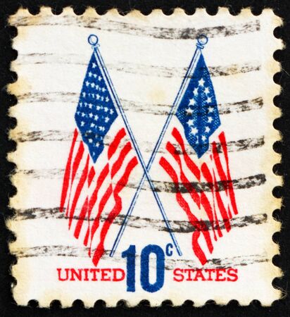 UNITED STATES OF AMERICA - CIRCA 1973: a stamp printed in the USA shows 50-Star and 13-Star Flags, circa 1973のeditorial素材