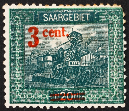 GERMANY - CIRCA 1921: a stamp printed in the Saar, Germany shows Entrance to Reden Mine, circa 1921のeditorial素材